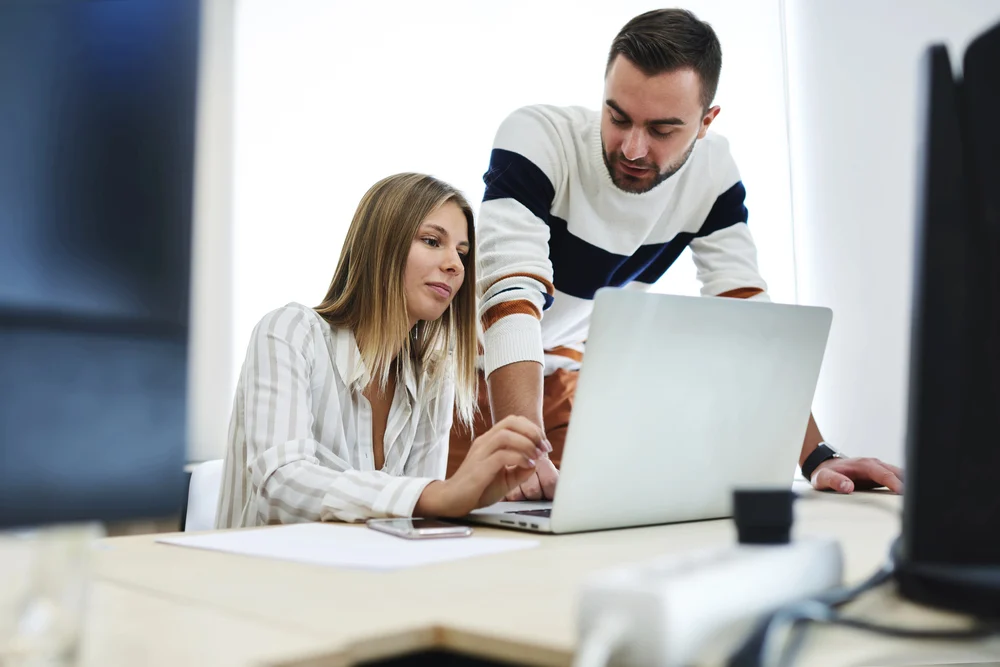 two professionals working on ethical eating disorder treatment marketing plans