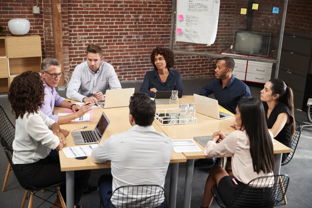 team collaborating on a local eating disorder treatment marketing strategy