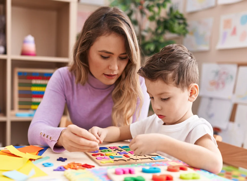 women working with child see found using our aba therapy ppc services