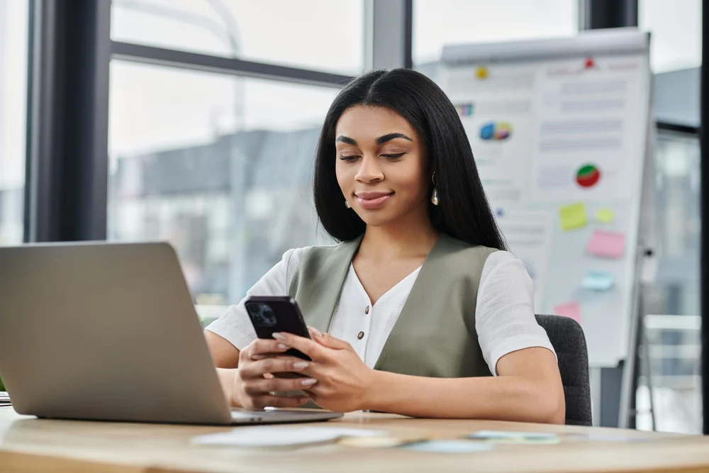 girl choosing a movie on her phone at work