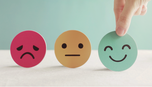 Emoticon concept from sad face to happy face after handling mental health concerns.