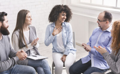 The Complete Guide To Getting Your Legitscript Certification 3 woman talking about getting legitscript certification with colleagues