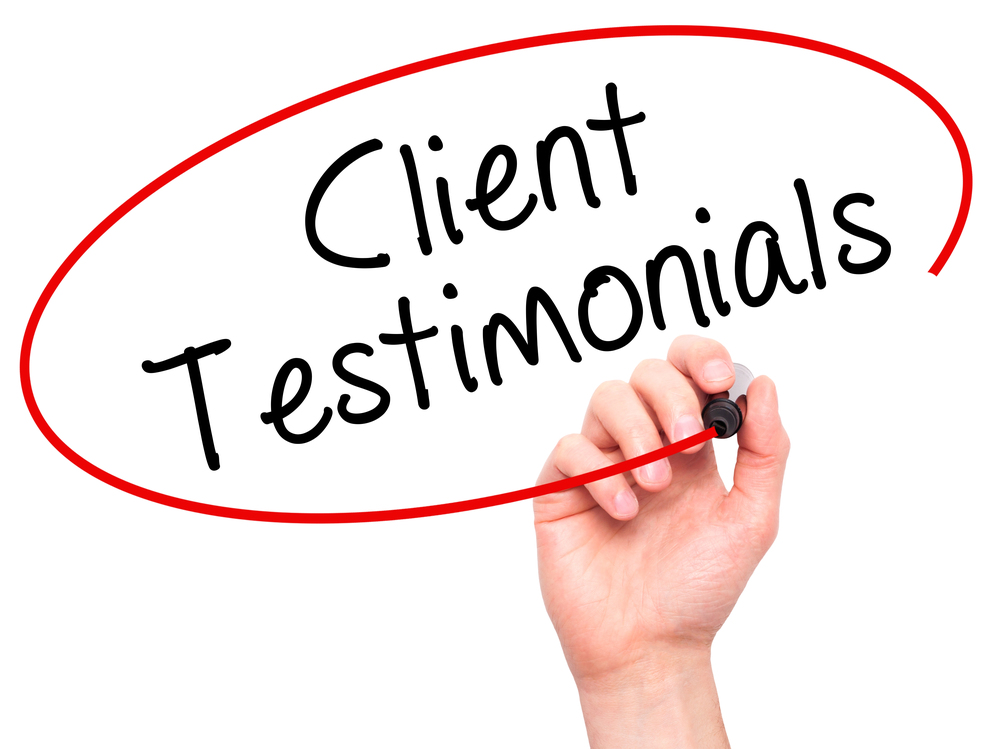 hand circling client testimonials